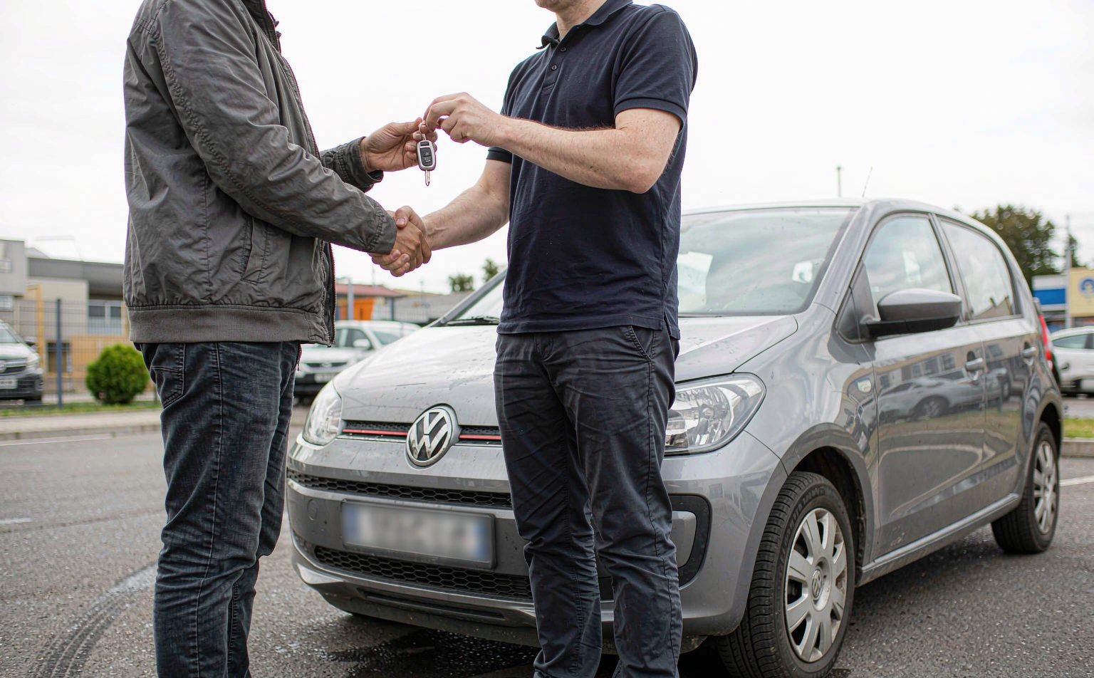 Home Handing over the keys to a customer at collection